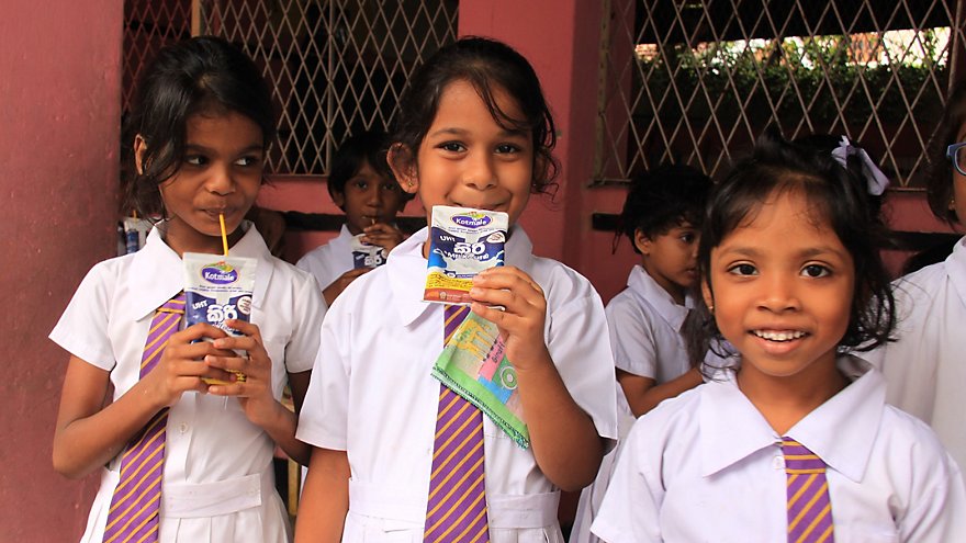 School girls drinking milk